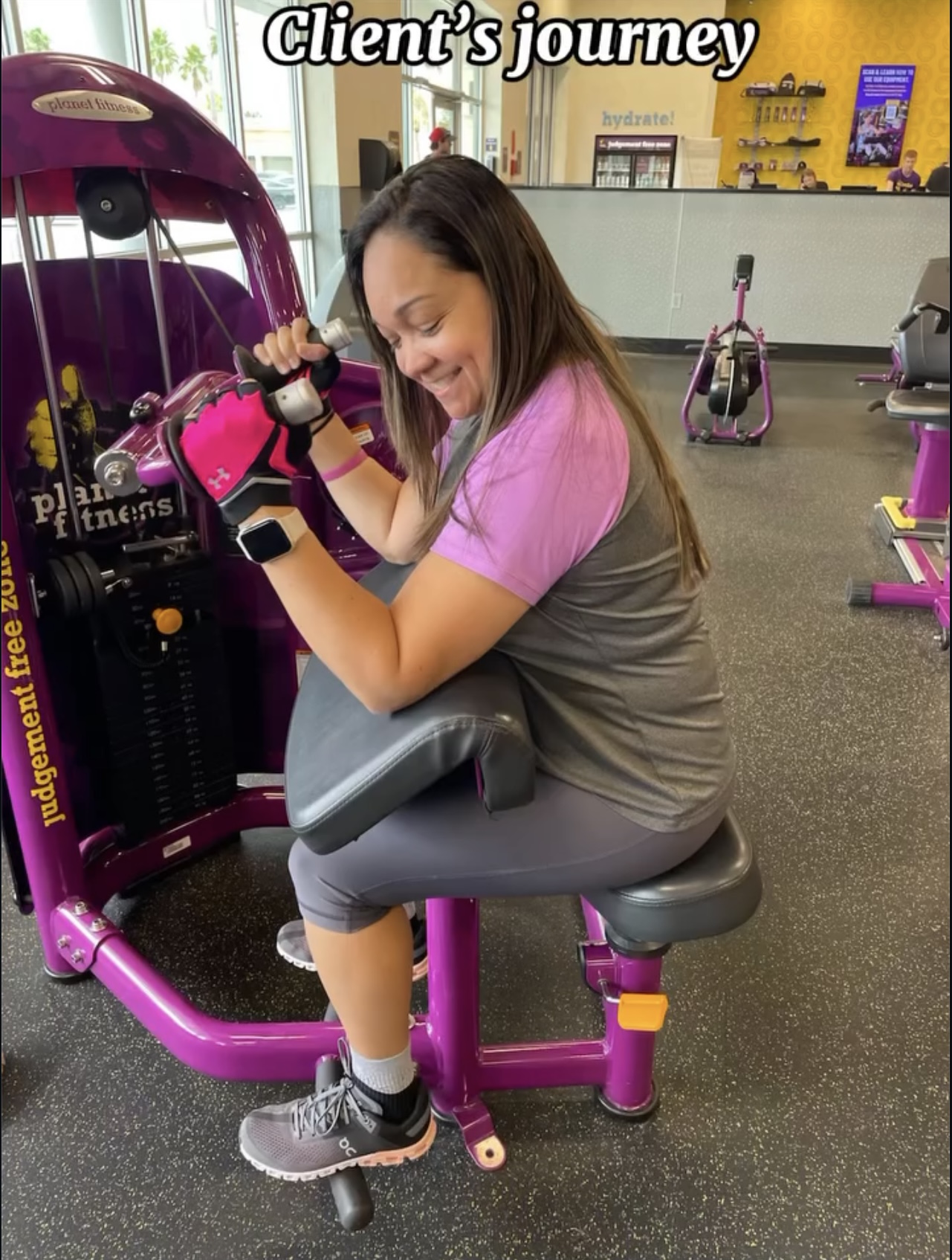 Young woman in gym clothes sitting on exercise equipment, smiling, with gym machines in background.
