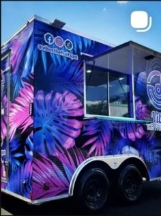 Colorful food truck with purple and blue floral design, window, and social media icons on top corner.