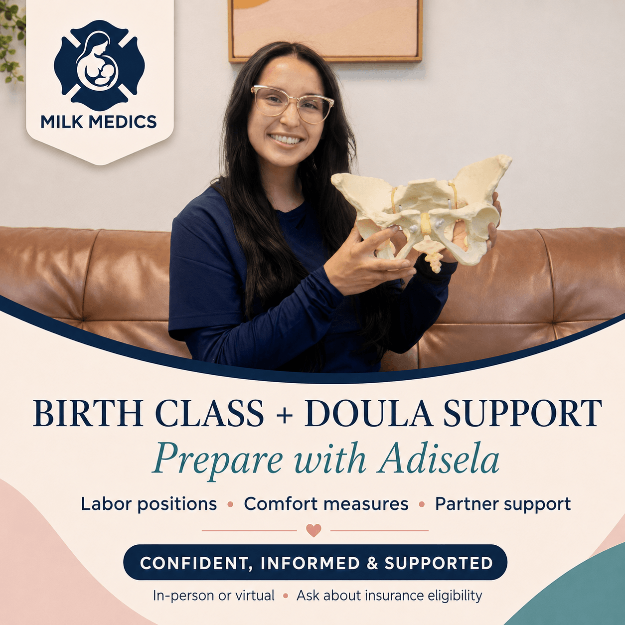 Woman smiling holding a pelvis model in a room with a 'Milk Medics' sign on the wall, promoting birth class and doula support.
